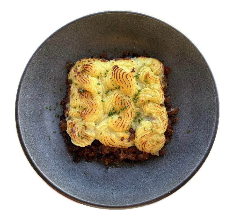 A finished dish from Ruthie's kitchen — cottage pie with piped mashed potato